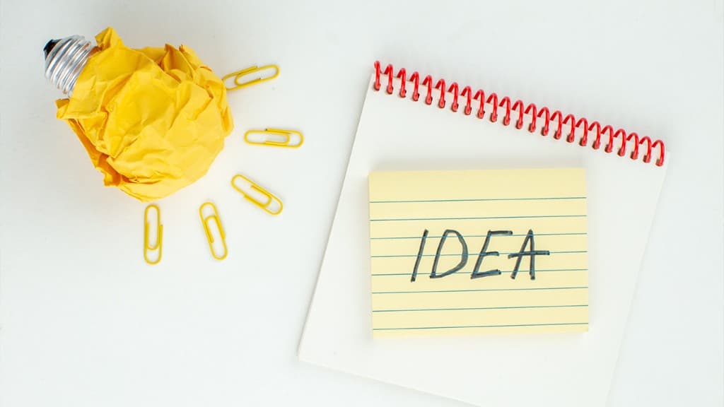 A paper lightbulb and a note that says IDEA